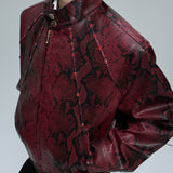 Opium Bombardeiro cravejado de pele de cobra